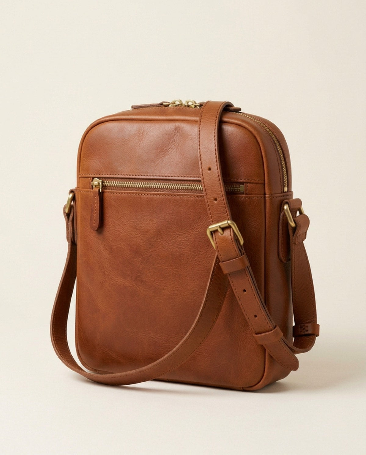 Marylebone Zip Messenger, brass-finish zips, adjustable strap detail